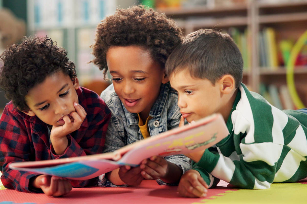Children reading together in an early learning classroom.