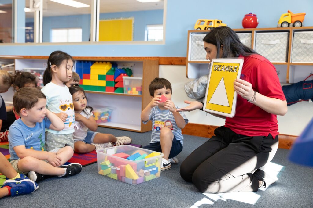 Buying a Preschool Franchise: A Step-by-Step Guide for Future Owners 2 Ivy Kids Franchise Preschool Teacher with Students